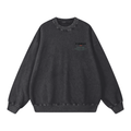 Praia do Norte crewneck in Black, front view showing the small Nazaré wave chest print