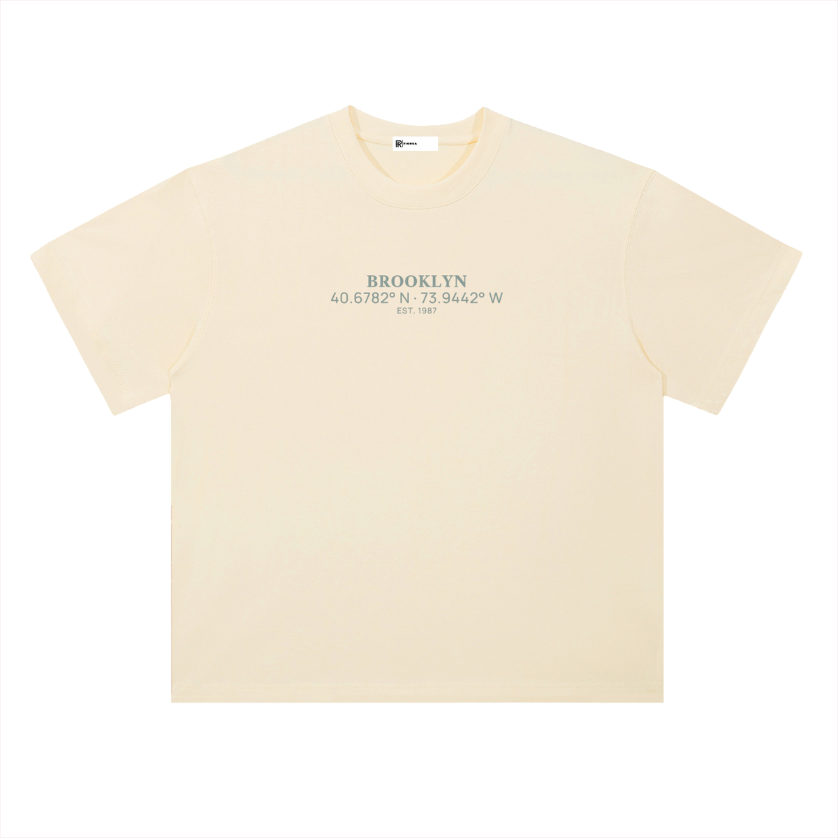 Heavyweight Coordinates tee in Milk Apricot, front view showing the Brooklyn coordinates chest print